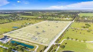 Aerial view of property and surrounding area with rural landscape