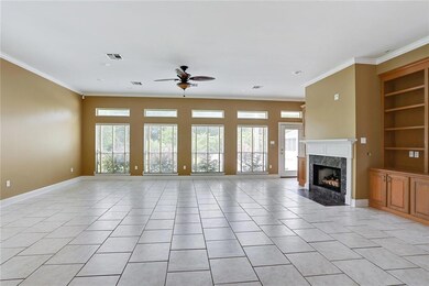 Spacious den is open to kitchen, has gas fireplace