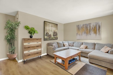 Living room with wood-type flooring
