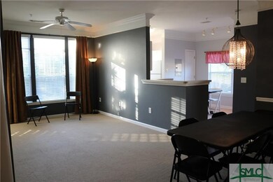 Showing dining area, triple windows, chair railing