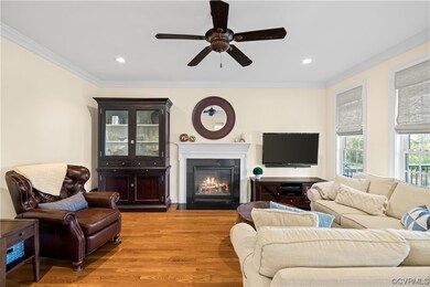 Living room with light wood-type flooring, ceiling