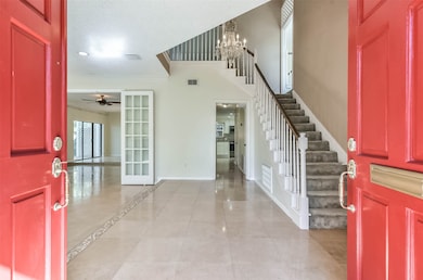 Entry-Enter this lovely home through the charming front doors and you will see high ceilings and an abundance of natural light.