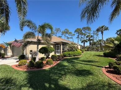 View of side of home with concrete driveway, a law