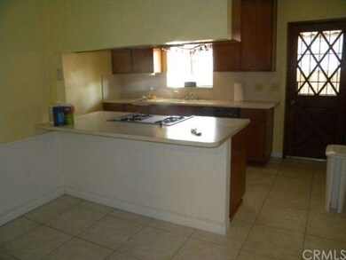 KITCHEN/ FORGROUND IS EATING AREA.