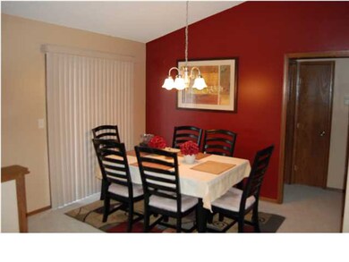 DINING ROOM AREA WITH SLIDNING DOORS TO WOOD DECK.