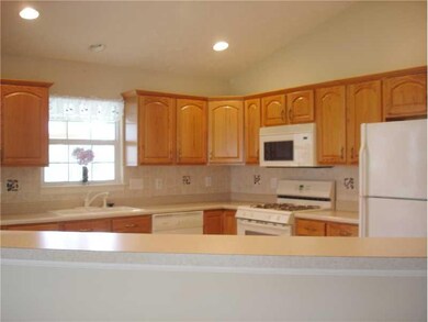 Kitchen. Breakfast bar is great for everyday or to use as a buffet when entertaining.
