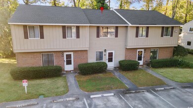 View of front of property featuring uncovered park