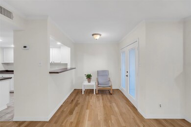 Unfurnished room with french doors, light wood-typ