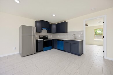 Modern and chic! Dark cabinets, granite coutnertop