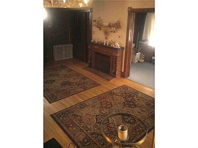 Living Room Gleaming Hardwood Floors and Leaded Gl