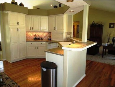 and features a wonderful eating bar, wood floors,