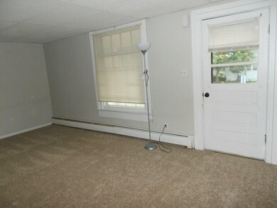 From open front porch, enter a large living room w