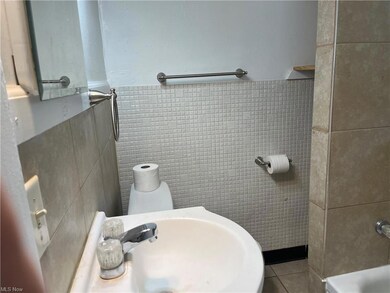 Updated bathroom with ceramic tile.