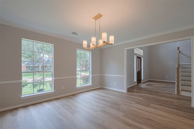 Alternate view of formal dining room with fresh pa