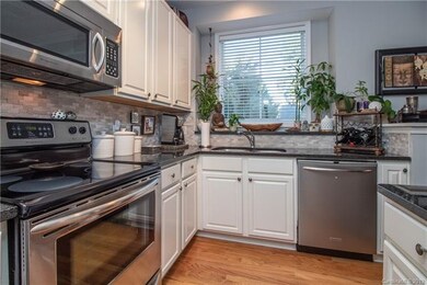 Kitchen With Hardwoods, Custom White Wood Cabinetr