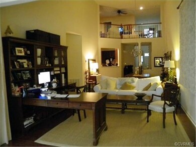 Expansive great room has open floor plan and cathe