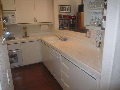 Prestine kitchen opens to dining room