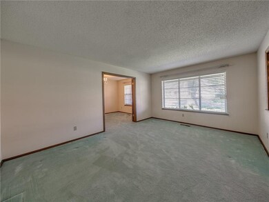 Formal living on the front. With windows looking o