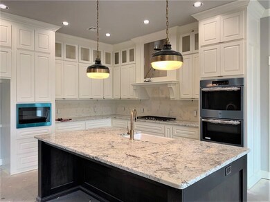 Gorgeous kitchen features plenty of storage and co