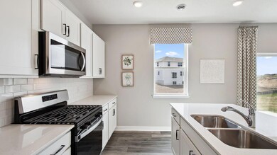 Kitchen window allows light to pour into your home, while cooking your favorite meals. *Pictures are of a model home; colors and finishes may vary. *
