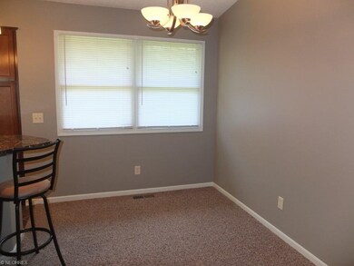 Dinette with new light fixture and new carpet.
