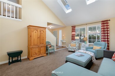 Bright, skylit living room w/ vaulted ceiling
