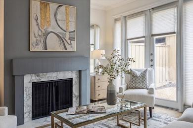 Carrara tile fireplace with abundant natural light