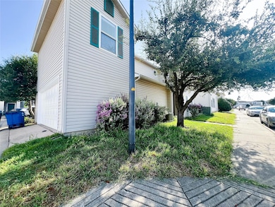 View of side of property featuring a garage
