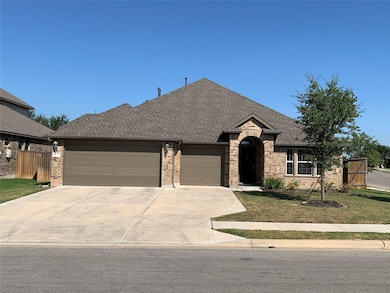 View of front of home featuring brick siding, an 