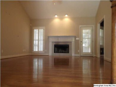 Great Room with soaring ceilings and hardwoods.