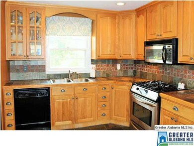 Beautiful wood cabinets with some stainless applia