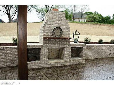 Patio/Deck. Stamped Concrete Patio with Brick Fireplace and Outdoor Cooking Area.  Covered Patio with Ceiling Fans, Lighting and Tongue & Groove Ceiling