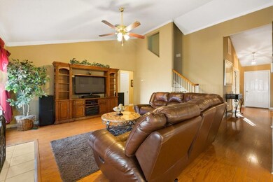 Den overlooking stairs and foyer area. Hardwood fl