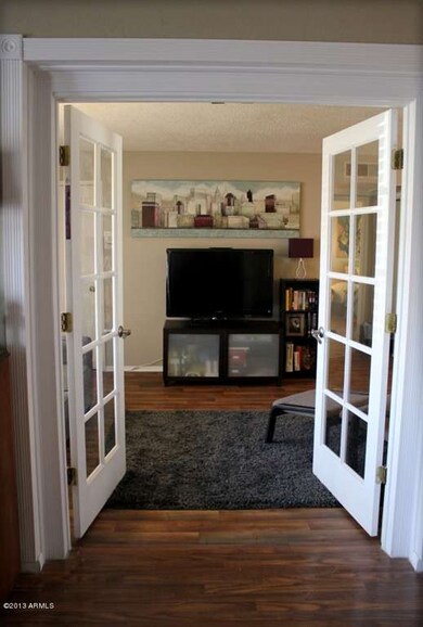 French Door Opens to Family Room