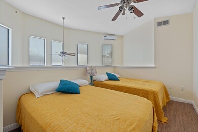Bedroom with wood finished floors and a ceiling fan