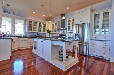 Kitchen with beautiful chestnut floors and granite