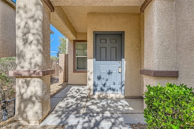 Entrance to property with stucco siding