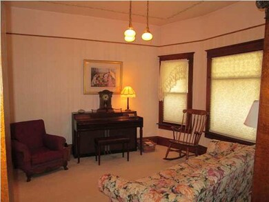 Front parlor has original picture molding, light f