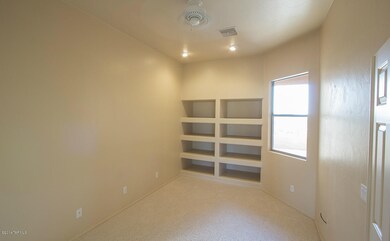 Den with built ins and double doors