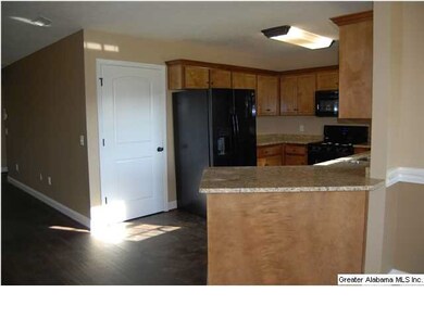Kitchen with breakfast bar and granite counter top