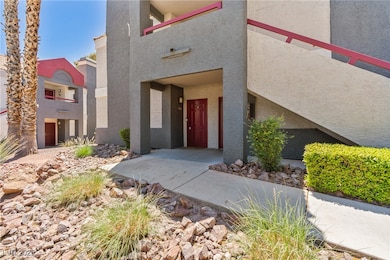 Property entrance featuring stucco siding
