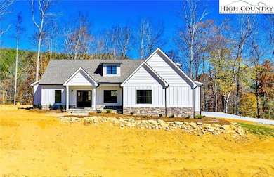Your newly constructed mountain retreat sits in a gated community with New River access!