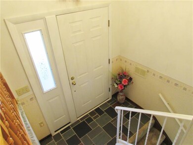 The Welcoming Front Door is flanked by a Sidelite 