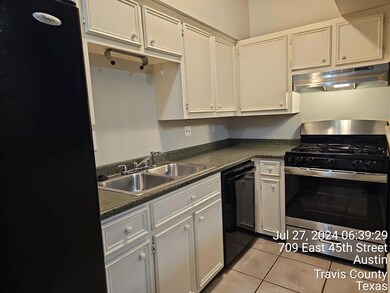 Kitchen featuring stainless steel range with gas 