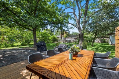 Wooden terrace featuring outdoor dining area, are