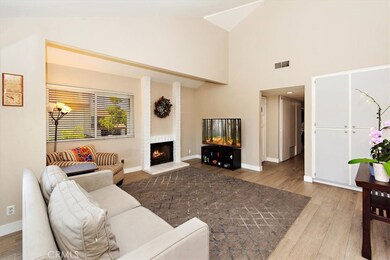 Spacious living room with cozy fireplace.