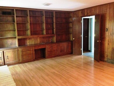 Bookshelves line the entire wall - tons of storage