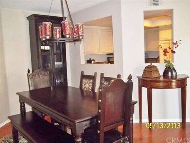VIEW FROM DINING AREA WITH PASS THRU INTO KITCHEN 