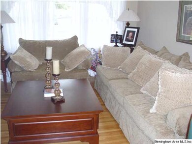 FORMAL LIVING ROOM WITH OAK HARDWOOD FLOORS