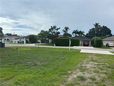 View of green lawn with driveway